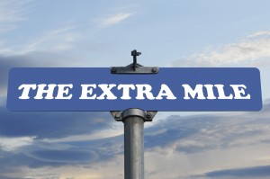 The extra mile road sign
